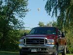 It's not everyday you can be at home and get a picture of power stroke turbo diesel with a hot air ballon over it.